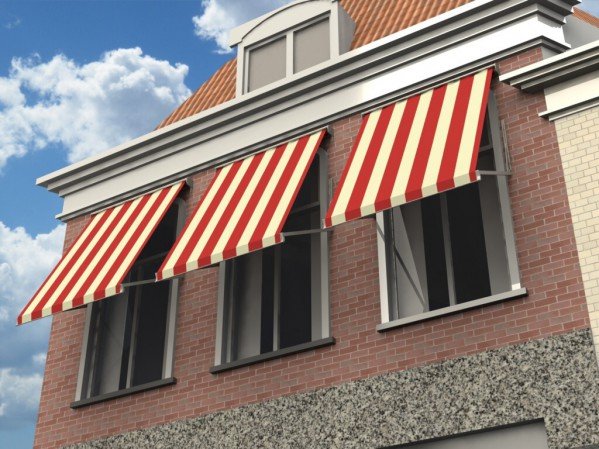 Op deze foto is een gebouw te zien met 3 uitvalschermen voor de ramen